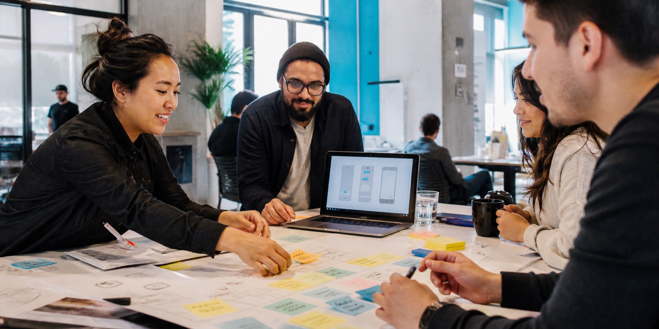 Entrepreneurs testing a product prototype together in a creative studio